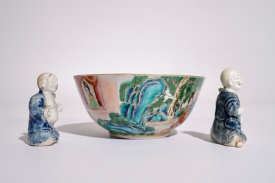 Two Chinese blue and white glazed biscuit figures of boys, Qianlong, and a Canton famille rose bowl, 19th C.