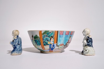 Two Chinese blue and white glazed biscuit figures of boys, Qianlong, and a Canton famille rose bowl, 19th C.