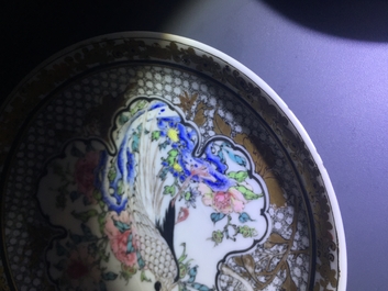 A fine Chinese famille rose and grisaille eggshell cup and saucer with a pheasant, Yongzheng