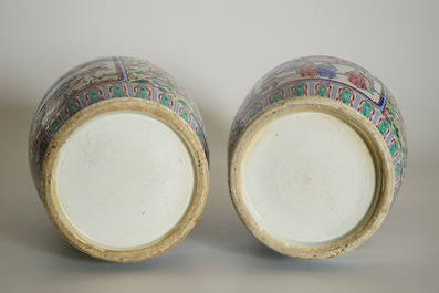 A pair of Chinese famille rose vases with court scenes, 19th C.