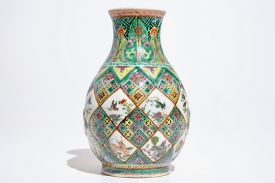 A Chinese famille verte vase with exotic animals, 19th C.