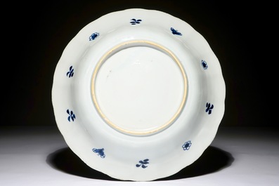 A Chinese blue and white dish with carps on the rim, Kangxi