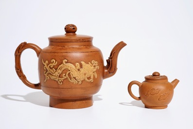 Two Chinese Yixing teapots with relief design, Kangxi and later