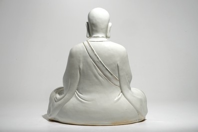 A large Chinese porcelain model of a seated Luohan, 20th C.