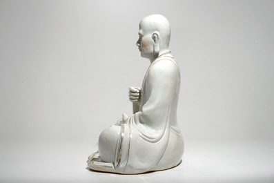 A large Chinese porcelain model of a seated Luohan, 20th C.