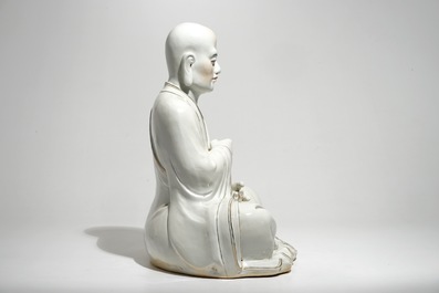 A large Chinese porcelain model of a seated Luohan, 20th C.