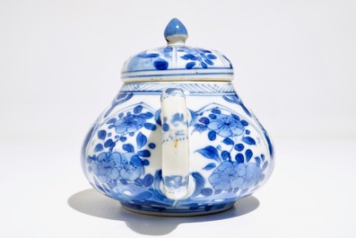 A Chinese blue and white teapot with figurative and floral panels, Kangxi