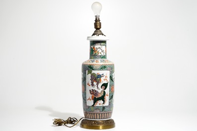 A bronze-mounted Chinese famille verte rouleau vase, transformed into a lamp, 19/20th C.