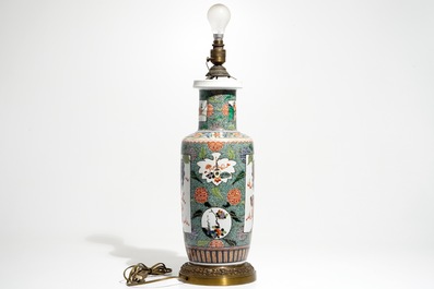 A bronze-mounted Chinese famille verte rouleau vase, transformed into a lamp, 19/20th C.