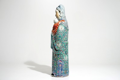 A tall Chinese famille rose figure of an immortal, 19th C.