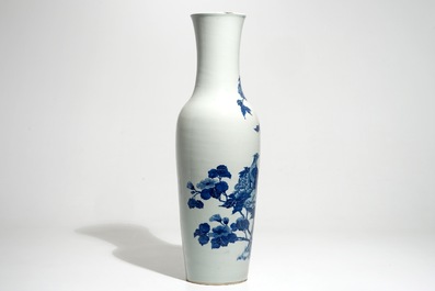 A tall Chinese blue and white vase with pheasants among flower blossoms, 19th C.