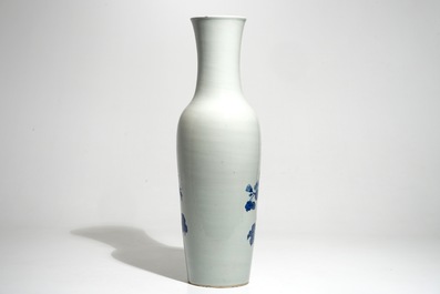 A tall Chinese blue and white vase with pheasants among flower blossoms, 19th C.