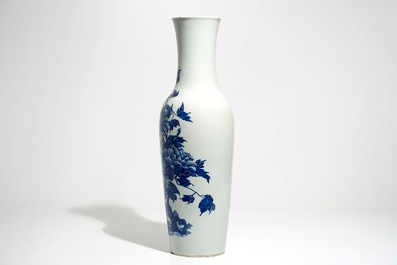 A tall Chinese blue and white vase with pheasants among flower blossoms, 19th C.