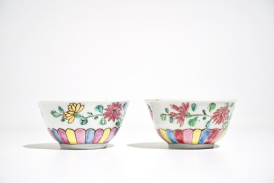 A pair of Chinese famille rose cups and saucers, Yongzheng/Qianlong