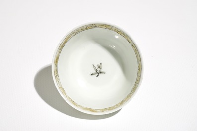 A Chinese grisaille and gilt cup and saucer with a fine landscape, Yongzheng