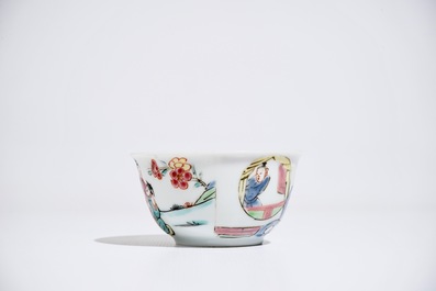 A Chinese famille rose cup and saucer with figures in a garden, Yongzheng