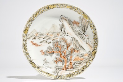 A Chinese grisaille and gilt cup and saucer with a fine landscape, Yongzheng