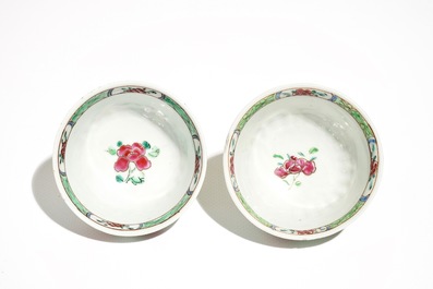 A pair of Chinese famille rose cups and saucers, Yongzheng/Qianlong