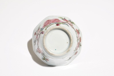 A Chinese famille rose cup and saucer with floral design, Yongzheng/Qianlong