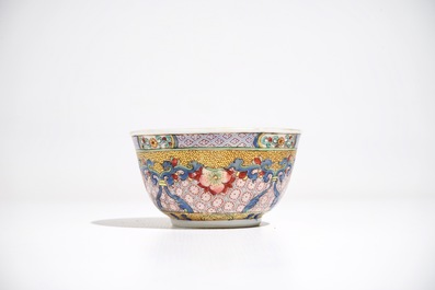 A Chinese famille rose cup and saucer with a cat, Yongzheng