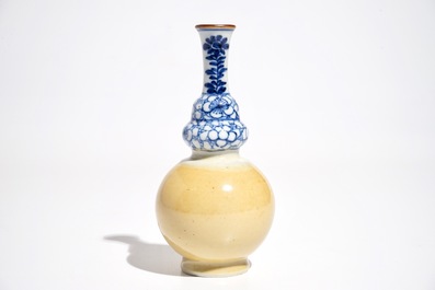 A Chinese blue and white and caf&eacute; au lait double gourd vase, Kangxi