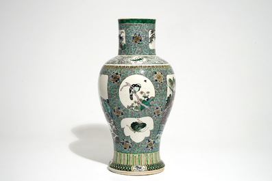 A Chinese verte enamel on biscuit vase with a fluvial landscape, Kangxi