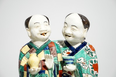 Two tall Chinese famille rose groups of the Hehe Er Xian brothers, 19/20th C.