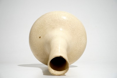 A Chinese cream-glazed bottle vase with anhua design, Song/Ming