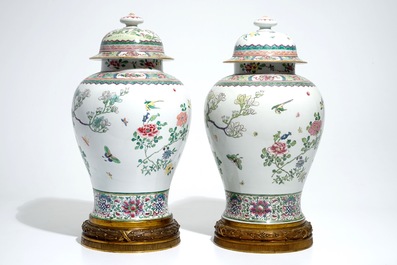 A pair of tall bronze-mounted famille rose baluster vases and covers, Samson, Paris, 19th C.