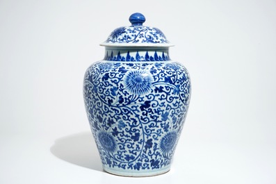 A tall Chinese blue and white baluster jar and cover with lotus scrolls, Kangxi