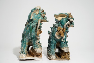 Two Chinese turquoise-glazed roof tiles shaped as temple lions, 17/18th C.