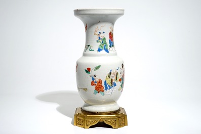 Un vase en porcelaine de Chine famille rose aux figures, mont&eacute; en bronze, Yongzheng