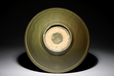 A Chinese Longquan celadon dish with floral underglaze design, Ming