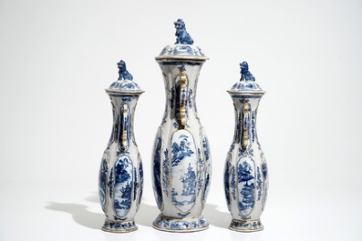 A garniture of three Chinese blue and white covered vases with landscape design, Qianlong