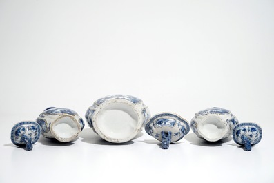 A garniture of three Chinese blue and white covered vases with landscape design, Qianlong