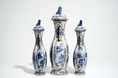 A garniture of three Chinese blue and white covered vases with landscape design, Qianlong