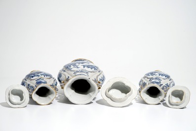 A garniture of three Chinese blue and white covered vases with landscape design, Qianlong