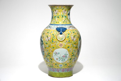 A tall Chinese famille rose yellow-ground vase with a tiger, Qianlong mark, 19th C.