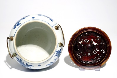 A Chinese blue and white bowl with wooden cover and bronze handles, Kangxi