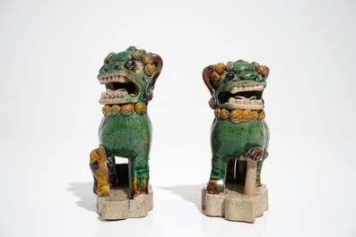 A pair of Chinese verte biscuit models of Buddhist lions, Kangxi