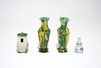 A pair of spinach and egg lozenge-shaped vases, a verte biscuit model of a boat and a miniature vase, Kangxi