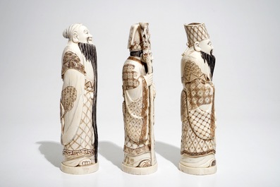 Three signed Japanese ivory okimono of bearded sages, Meiji, early 20th C.