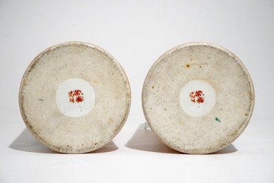 A pair of Chinese famille rose salmon pink-ground hat stands and a blue and white charger, 19/20th C.