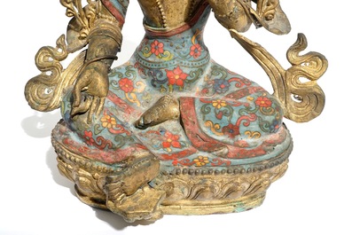 A large Chinese gilt bronze and cloisonn&eacute; figure of Green Tara, 19th C.