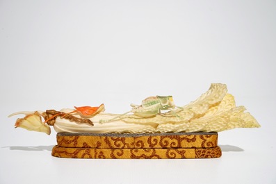 A Chinese polychrome ivory group of a cricket on cabbage, early 20th C.