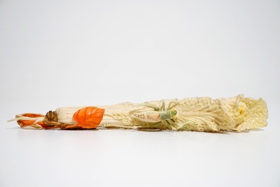 A Chinese polychrome ivory group of a cricket on cabbage, early 20th C.