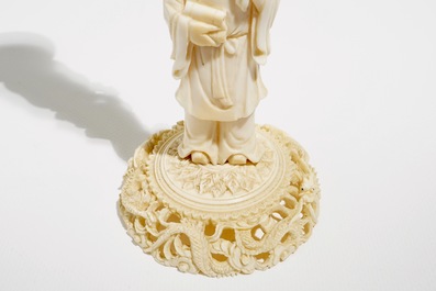 Two Chinese Canton ivory puzzle balls on stands and a figure of a sage, 19th C.
