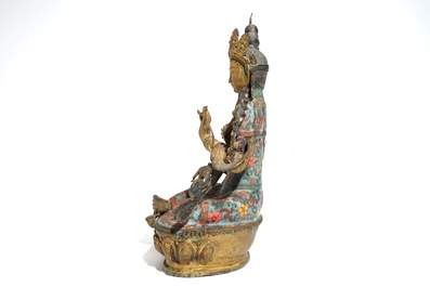 A large Chinese gilt bronze and cloisonn&eacute; figure of Green Tara, 19th C.