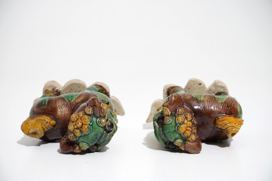 A pair of Chinese verte biscuit models of Buddhist lions, Kangxi