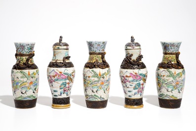 Two Chinese Nanking famille rose covered vases and three Nanking famille verte vases, 19th C.